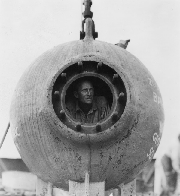 William Beebe peers out of the Bathysphere, 1934. WCS Photo Collection