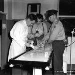 wildlife-conservation-society_19321_cbs-radio-broadcast-at-hospital-goss-treating-lion-cub_bz_06-00-41-wm