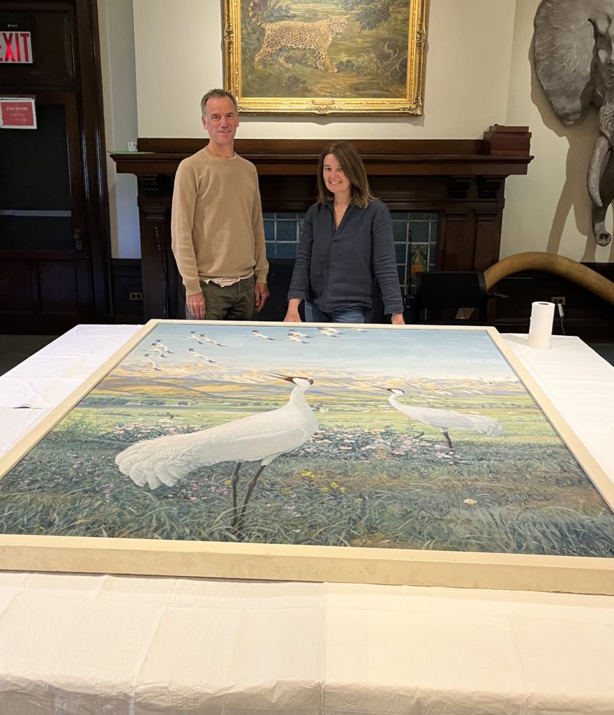 Conservator Nadia Ghannam (R) and Art Preparator (Steven Day) preparing to work on the painting.